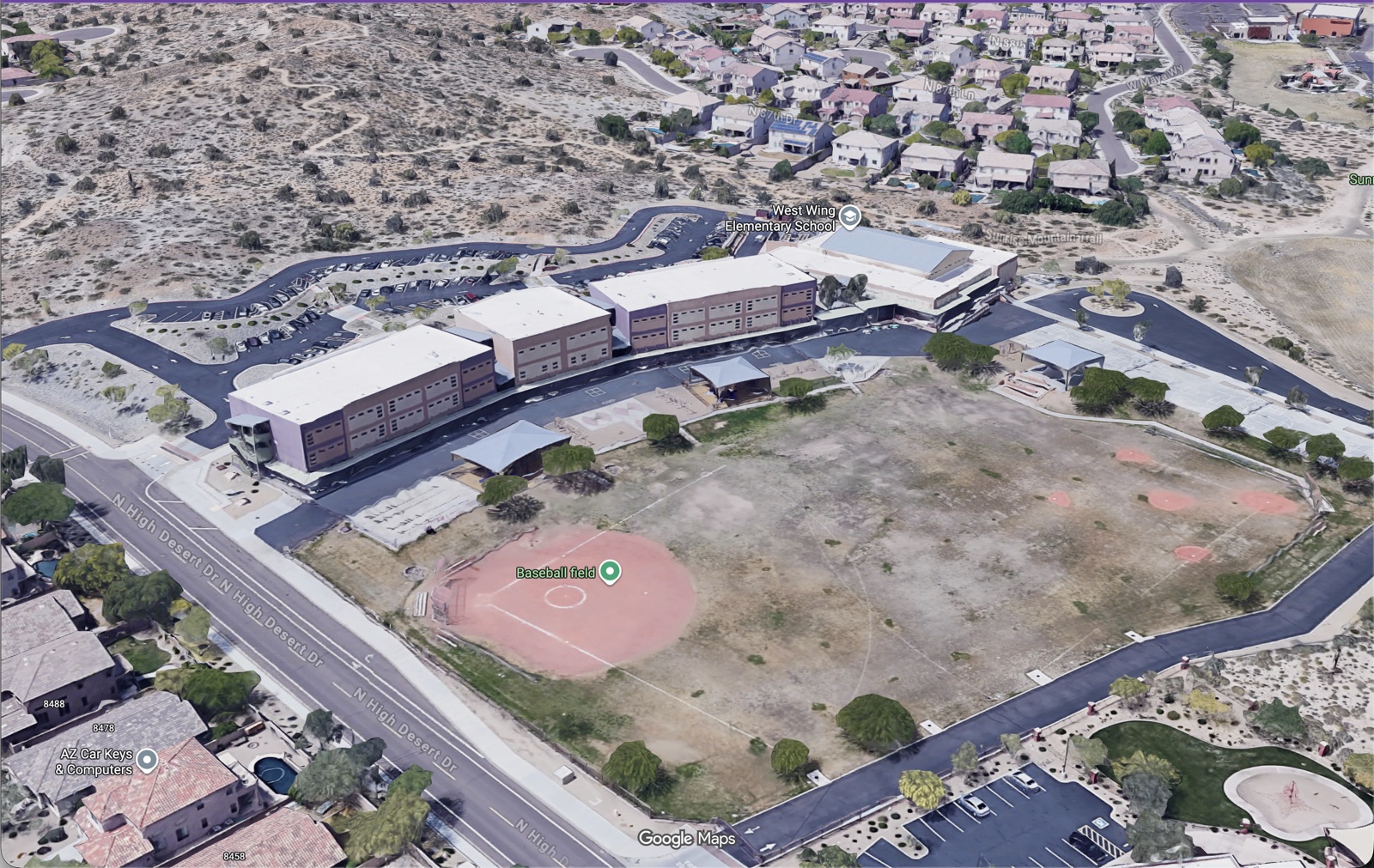 Aerial view of West Wing Elementary School from the south, showing the school, baseball field, and surrounding streets